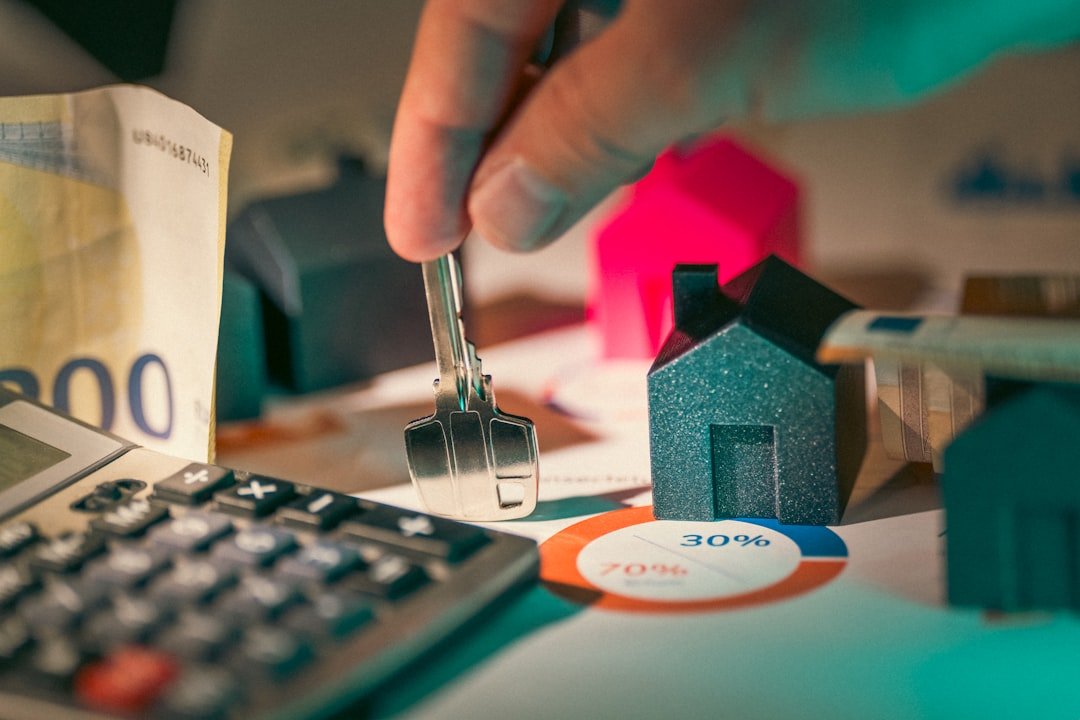 Hand holding the key to a new home