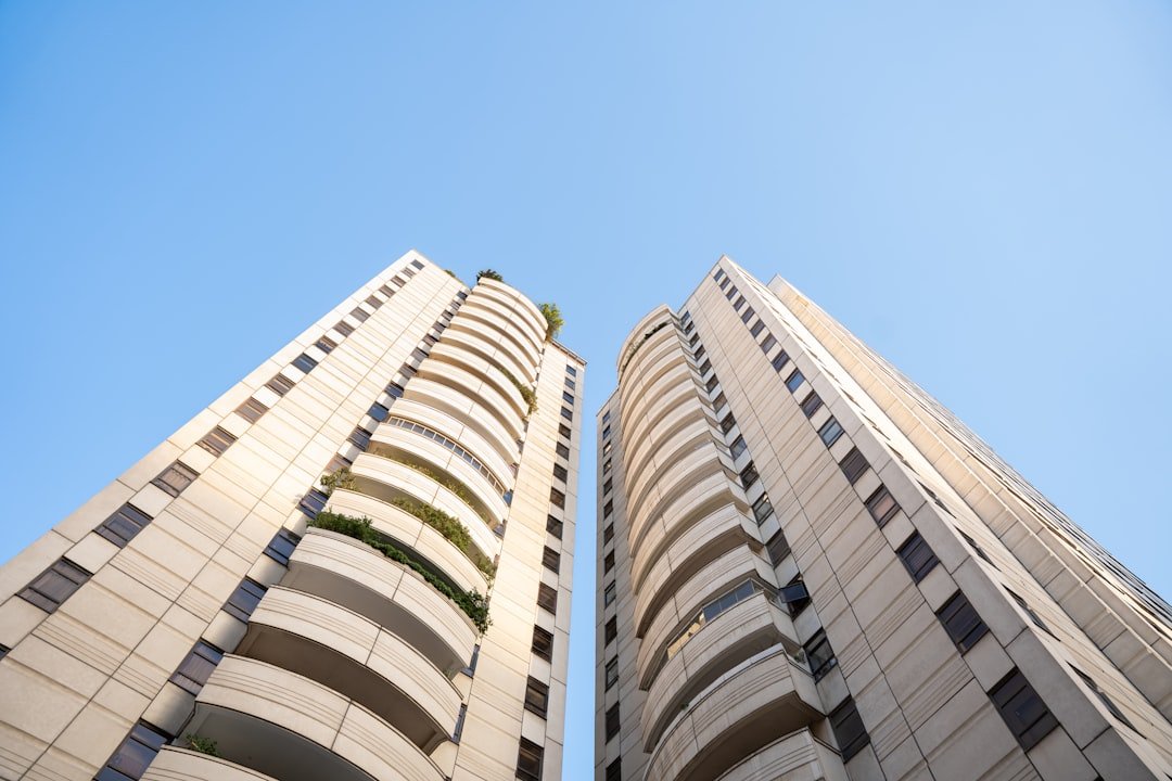 Modern residential towers against a blue sky