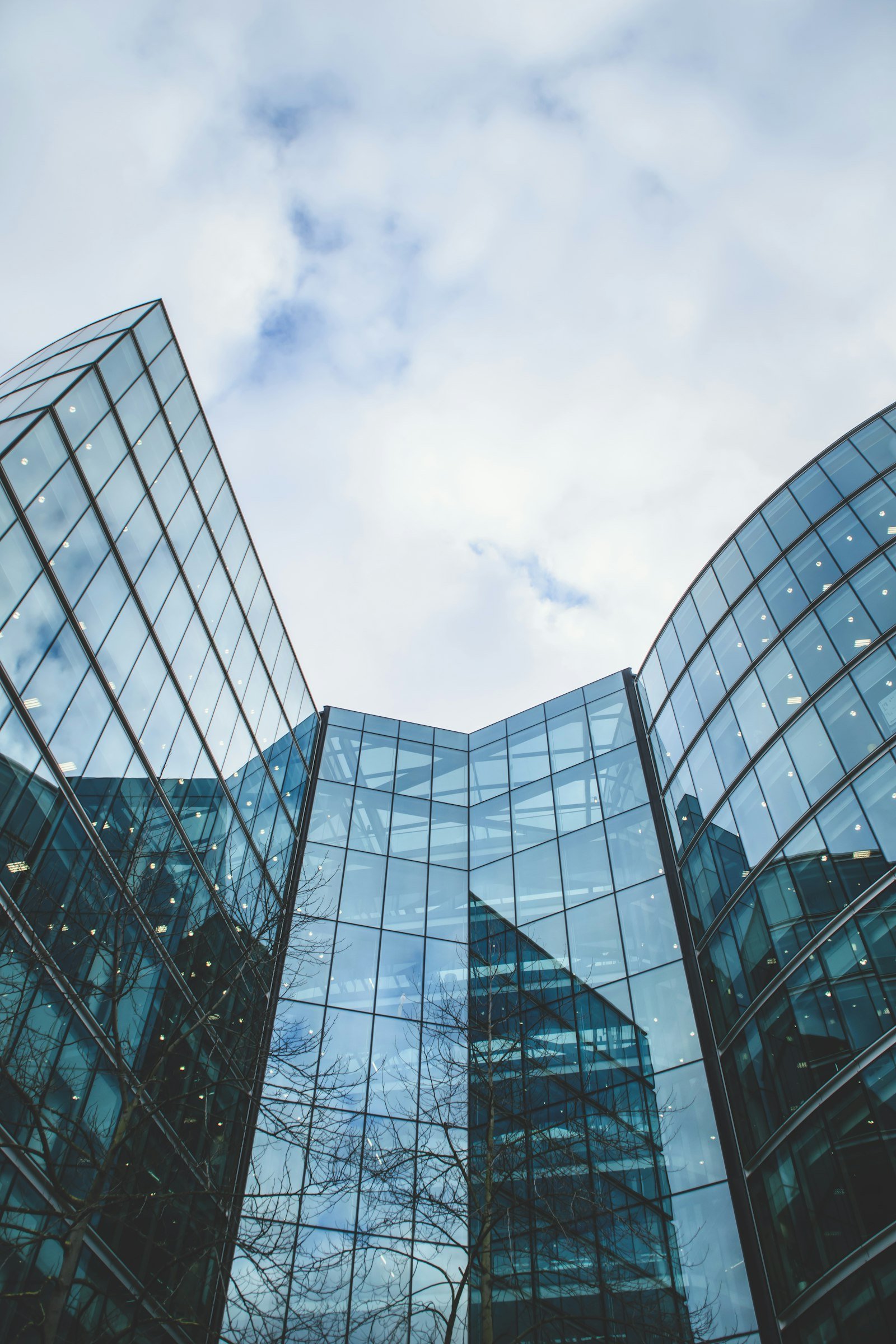Glass office tower viewed from below